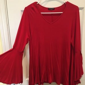 Red trumpet sleeve V neck top. Size M